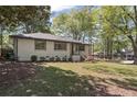 Beautiful home featuring well-manicured front yard, lush greenery, and a classic design at 1089 Greenleaf Se Rd, Atlanta, GA 30316