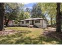 Charming single-story home showcasing an inviting front yard with stone walkway at 1089 Greenleaf Se Rd, Atlanta, GA 30316