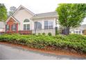 Beautiful home featuring a landscaped front yard, black metal fence, and manicured bushes at 1535 Duluth Hwy # 1104, Lawrenceville, GA 30043