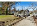 Well-maintained home featuring a cozy front porch, driveway, and a beautifully manicured lawn at 777 Forrest Nw St, Atlanta, GA 30318