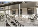 Inviting front porch with a porch swing, seating and stylish gray finishes at 777 Forrest Nw St, Atlanta, GA 30318