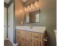 Bathroom featuring a modern vanity, framed mirror, and updated hardware at 175 Stoneview Cir, Covington, GA 30016