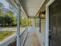 Covered front porch with views of the landscaped front yard and nearby street at 175 Stoneview Cir, Covington, GA 30016