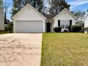 Charming single-story home with a well-manicured lawn, two-car garage, and inviting curb appeal at 2329 Wavetree Nw Ln, Acworth, GA 30101