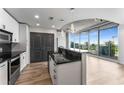 Modern kitchen featuring a granite countertop island and stainless steel appliances at 860 Peachtree Ne St # 2118, Atlanta, GA 30308