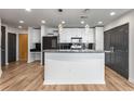 Contemporary kitchen with white cabinetry, granite countertops, and stainless appliances at 860 Peachtree Ne St # 2118, Atlanta, GA 30308