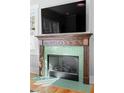 A fireplace with distinctive trim and green tile at 1181 Cleburne Ne Ave, Atlanta, GA 30307