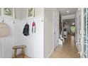 Functional entryway with board and batten detail, hooks, and a clear view of the home interior at 138 Bryon Ln, Acworth, GA 30102