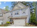 Inviting two-story home with a classic design, a two-car garage, and well-maintained landscaping at 138 Bryon Ln, Acworth, GA 30102