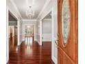 Bright entryway featuring hardwood floors and a decorative chandelier at 255 Helens Manor Dr, Lawrenceville, GA 30045