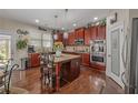 Gourmet kitchen with granite countertops, stainless steel appliances, and a center island at 4015 Two Bridge Ct, Buford, GA 30518