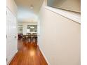 Inviting foyer with hardwood floors leading to the dining area and living spaces at 6884 Barker Station Walk, Sugar Hill, GA 30518