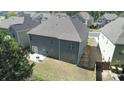 Aerial view of home's backyard, complete with a patio and plenty of green space at 550 Breton Highlands, Fairburn, GA 30213