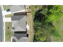Aerial view showcasing the home's well-maintained backyard and mature trees at 550 Breton Highlands, Fairburn, GA 30213