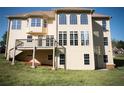 Two-story home featuring a balcony and numerous windows for ample natural light at 2328 New Haven Pl, Conyers, GA 30094