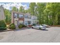Attractive townhome featuring a classic design and convenient parking at 984 Redwood Dr, Norcross, GA 30093