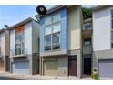 Townhome exterior showcasing modern design and individual garages at 1390 Stirling Nw Cir, Atlanta, GA 30318