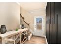 Welcoming foyer with modern decor, elegant staircase, and stylish wood flooring at 143 Massey Ln, Locust Grove, GA 30248