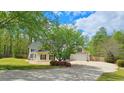 Attractive two-story house with a well-kept lawn, patio, basketball hoop and garage at 156 Brookridge Ct, Douglasville, GA 30134