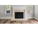 Elegant fireplace with a decorative mantle and hearth, flanked by windows at 3705 Paces Park Se Cir, Smyrna, GA 30080