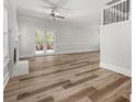 Bright, open living room featuring hardwood floors, a fireplace, and French doors to the yard at 3705 Paces Park Se Cir, Smyrna, GA 30080
