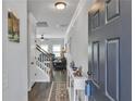 Inviting entryway featuring hardwood floors, neutral paint, and views into living area at 265 Valley Xing, Canton, GA 30114