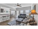 Open-concept living room with ample natural light, neutral colors, and modern furnishings at 265 Valley Xing, Canton, GA 30114