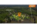Aerial view of property showing storage shed, lake access, and a no through traffic location at 50 Silver Lake Dr, Mansfield, GA 30055
