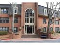 Attractive brick building with a grand entrance, a large arched window, and manicured landscaping at 24317 Plantation Ne Dr, Atlanta, GA 30324