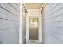 Close-up of front door with sidelight and sidelight, showing address under decorative light fixture at 2721 Kemp Sw Ct, Conyers, GA 30094