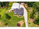 Aerial view showcasing a landscaped property with a long driveway and well-maintained lawns at 84 Ledbetter Rd, Villa Rica, GA 30180