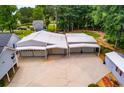 Aerial shot of a large garage with multiple bays and an expansive concrete driveway at 84 Ledbetter Rd, Villa Rica, GA 30180