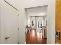 View into a well-lit living room with hardwood floors, modern furnishings, and a balcony at 870 Inman Village Ne Pkwy # 305, Atlanta, GA 30307