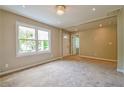 Bright living room featuring plush carpet, a large window, and neutral paint at 269 Moreland Way, Atlanta, GA 30354