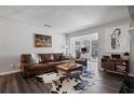 Spacious living room showcasing hardwood floors and a cozy seating area at 401 Berkeley Woods Dr, Duluth, GA 30096