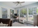Bright sunroom with large windows and ample natural light overlooking the backyard at 401 Berkeley Woods Dr, Duluth, GA 30096