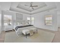 Bright main bedroom features carpet, neutral tones, a trey ceiling, and ample natural light at 4915 Bergen Ct, Cumming, GA 30040
