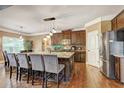 Spacious kitchen features a large island, breakfast bar and stainless steel refrigerator at 5280 Clingman Ct, Douglasville, GA 30135