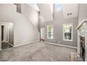 Bright living room with vaulted ceilings and a stone fireplace at 432 Tanner Farm Dr, Rockmart, GA 30153