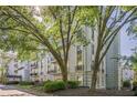 Beautiful condominium building showcasing lush landscaping and glimpses of private balconies at 3203 Lenox Ne Rd # 32, Atlanta, GA 30324