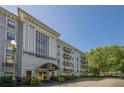 Upscale condo building features manicured landscaping and a welcoming entrance at 3203 Lenox Ne Rd # 32, Atlanta, GA 30324