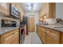 Efficient kitchen with stainless appliances, granite counters, and ample cabinet space at 3203 Lenox Ne Rd # 32, Atlanta, GA 30324