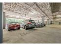 View of parking garage with assigned parking spots and overhead pipes at 3203 Lenox Ne Rd # 32, Atlanta, GA 30324