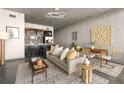 Open concept living room and kitchen with modern decor and natural light at 480 John Wesley Dobbs Ne Ave # 716, Atlanta, GA 30312