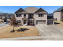Charming brick home with a well-manicured lawn and a three-car garage at 975 Matt Springs Ct, Lawrenceville, GA 30045