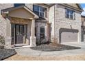 Welcoming front entrance showcasing a stylish door and a well-maintained landscape at 975 Matt Springs Ct, Lawrenceville, GA 30045