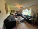 Cozy living room with large windows and ample seating at 1727 Walt Stephens Rd, Jonesboro, GA 30236