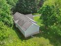 Birds eye view of a well maintained home with mature trees and landscaping at 5711 Parks Rd, Cumming, GA 30041