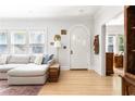 Bright living room with hardwood floors, white walls, and arched doorway at 812 E Ponce De Leon Ave, Decatur, GA 30030