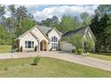 Lovely single-Gathering home with well-maintained lawn, paved driveway and attached two car garage at 3070 Glad Dale Se Dr, Conyers, GA 30094